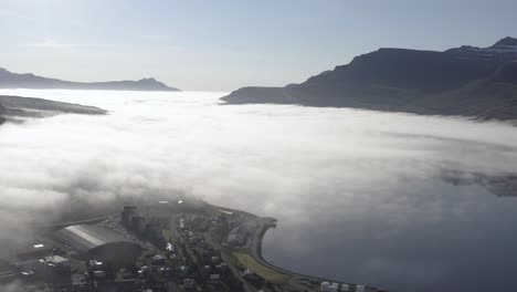 incredible big fjord surrounded by steep mountains in iceland, aerial