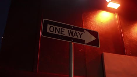 very nice and smooth orbiting shot of a one way sign back light by some color changing led lights