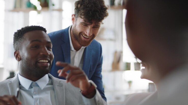 Diverse Business Team Laughing and Collaborating in Modern Office