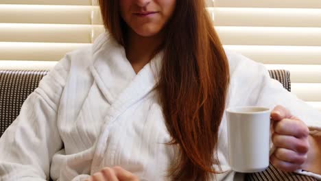 Woman-having-coffee-in-hotel