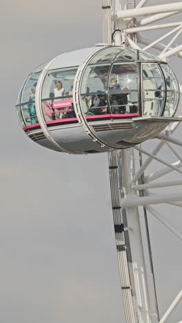 the london eye millennium wheel and skyline of london in vertical