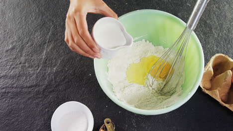 woman mixing milk in flour 4k