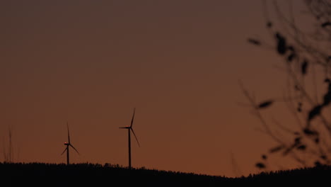 wind power generator turbine, at a sunny, evening dusk, in hoga kusten, vasternorrland, sweden