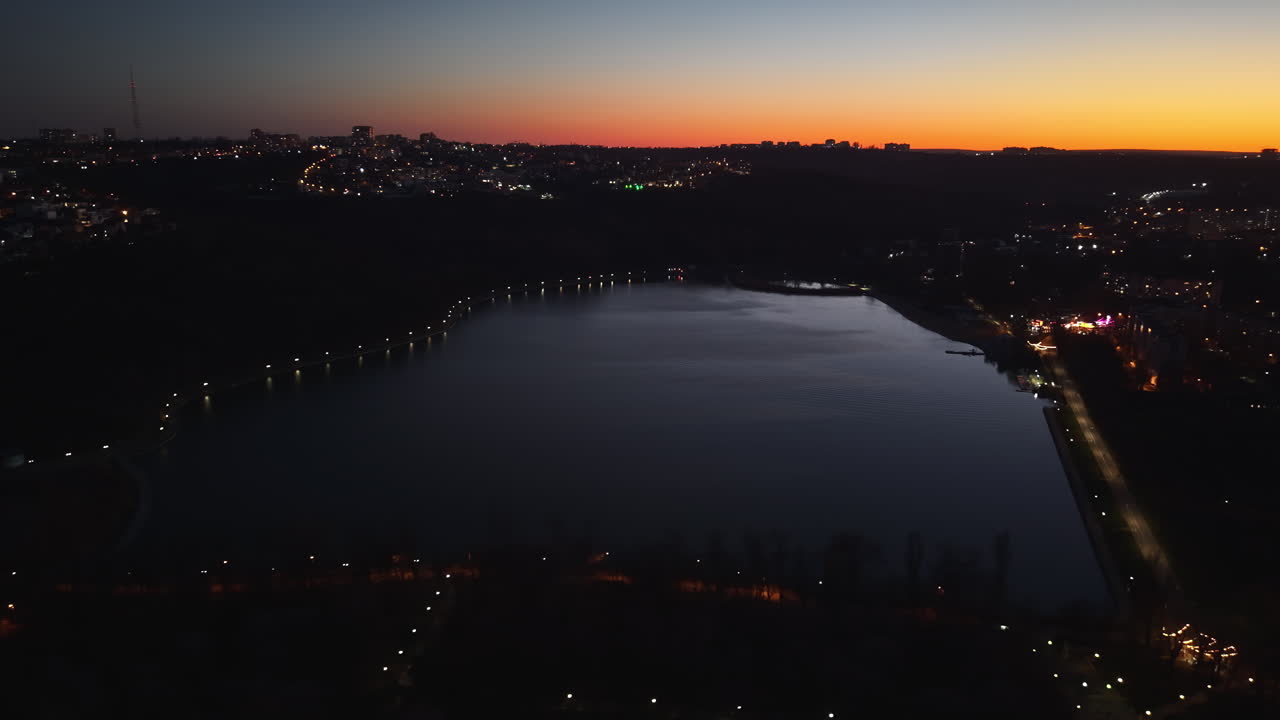 Aerial drone view of the lake in the Valea Morilor Park in Chisinau, Moldova at sunset