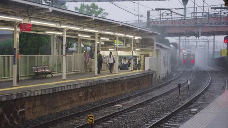 rainy day at a japanese train station platform
