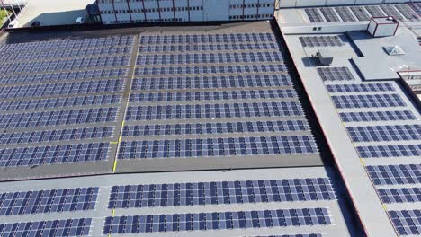aerial revealing 7546 solar panels on rooftop of asko industrial building outside bergen norway
