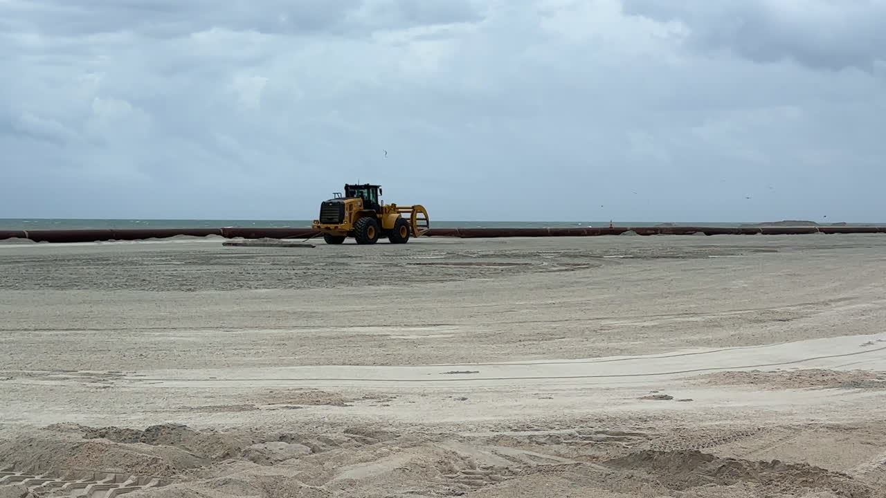 Beach Restoration Project: Heavy Machinery on Seashore