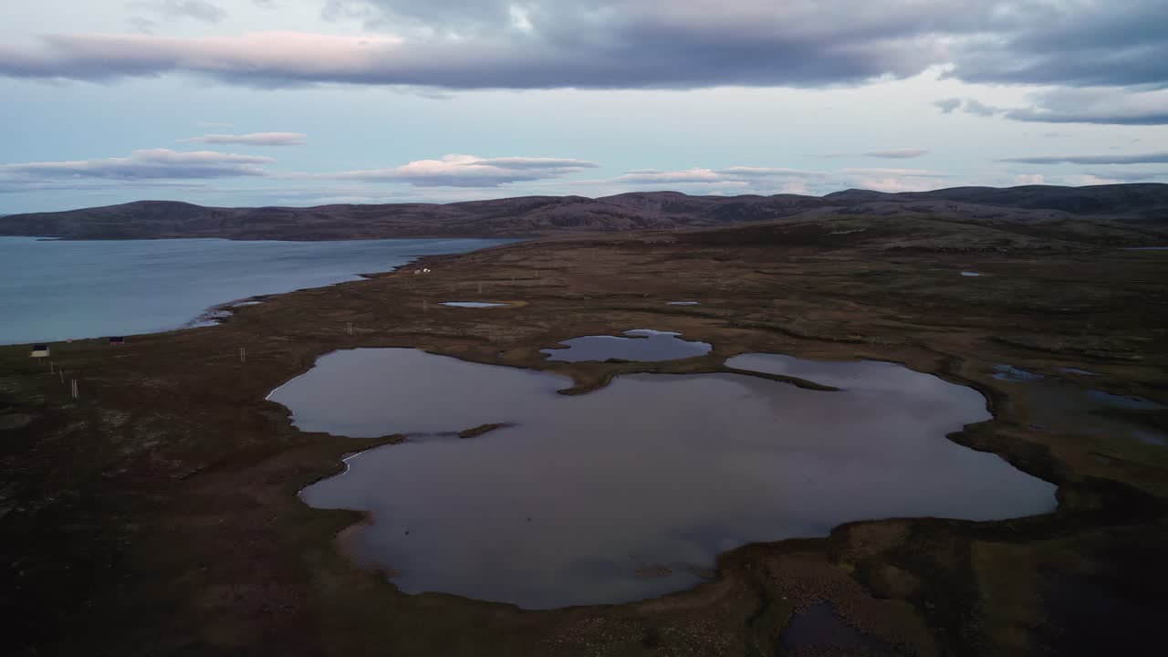 Panorama of northern Norway, lakes and hills in delicate, pastel tones