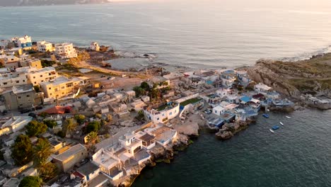 aerial view of seafront buildings and restaurants in enfeh, lebanon