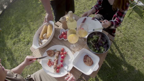 lunch with meat, lettuce, cherry tomatoes, corn and juice