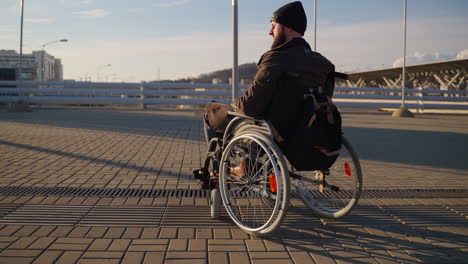 man in wheelchair outdoors