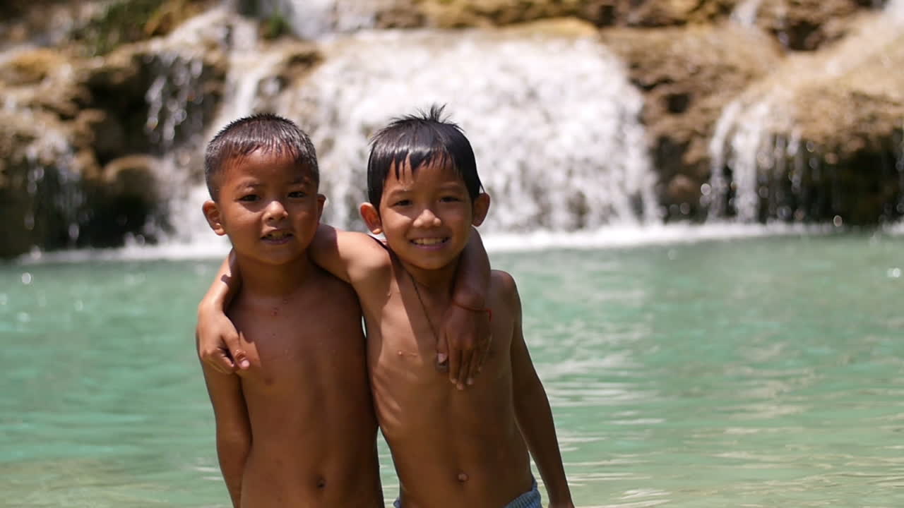 Two Boys at a Waterfall