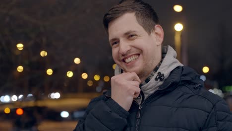 positive emotions - young man laughs with wide smile, close up with copy space