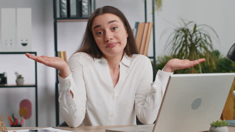 Confused businesswoman embarrassed about ambiguous question having doubts no answer idea clueless