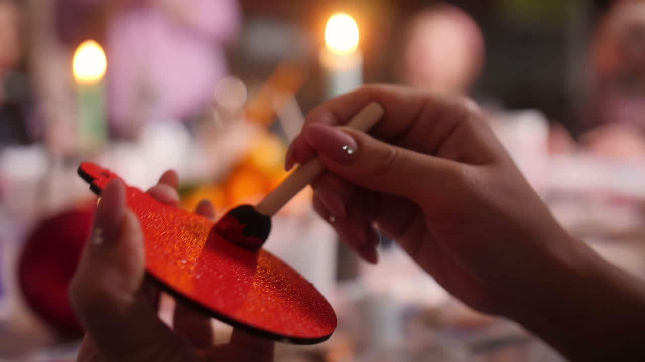 Painting a Wooden Ornament at a Family Craft Gathering