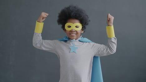 child dressed as a superhero