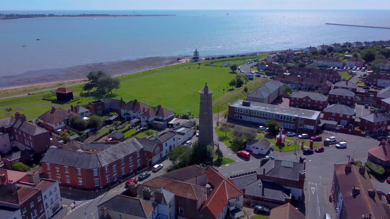 aerial view of Harwich town in Essex, England, Haven ports on the North Sea coast. drone approaching the lighthouse with seascape view on a sunny day