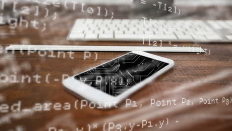 microprocessor connections and data processing against smartphone on wooden surface