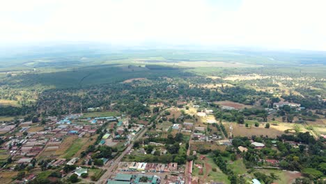 Aerial-drone-view-Open-Air-market-in-the-Loitokitok-town,-Kenya-and-mount-Kilimanjaro--Rural-village-of-Kenya