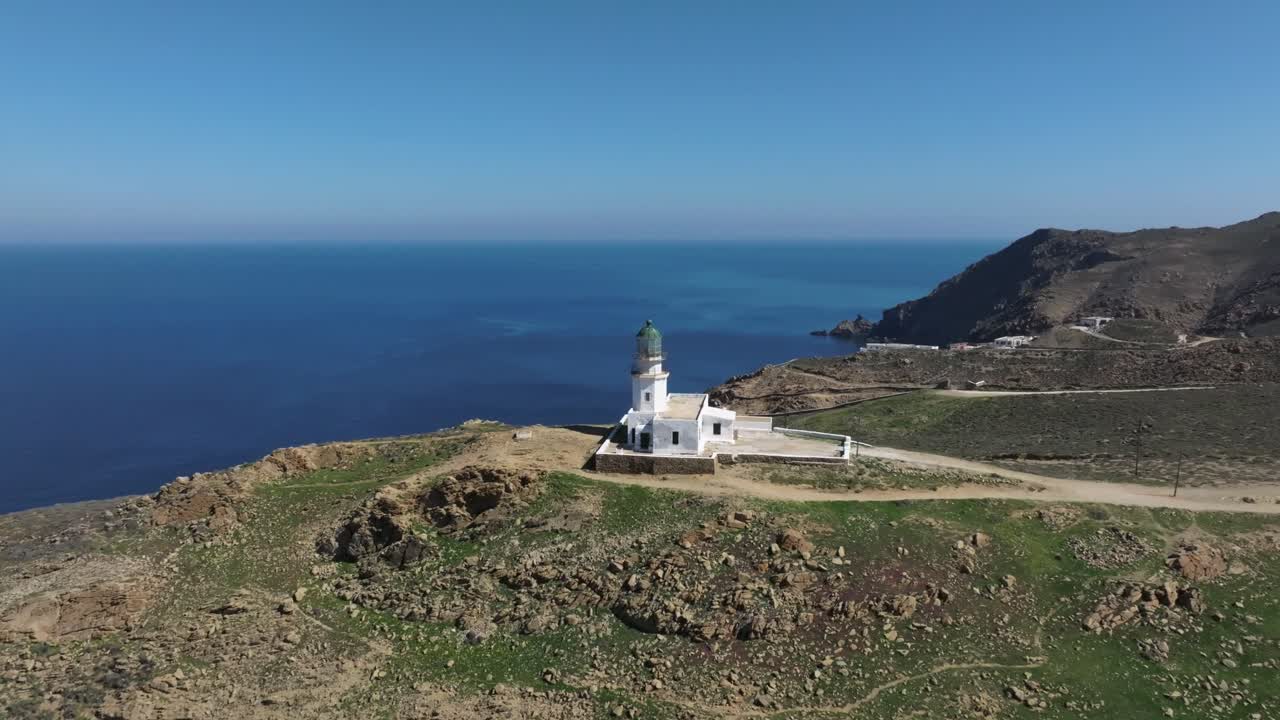 Approaching Armenistis Lighthouse in Mykonos, revealing the island’s stunning coastal landscape and panoramic Aegean Sea views