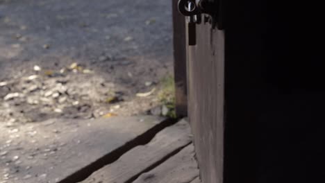 closing wooden rustic door to the outside world