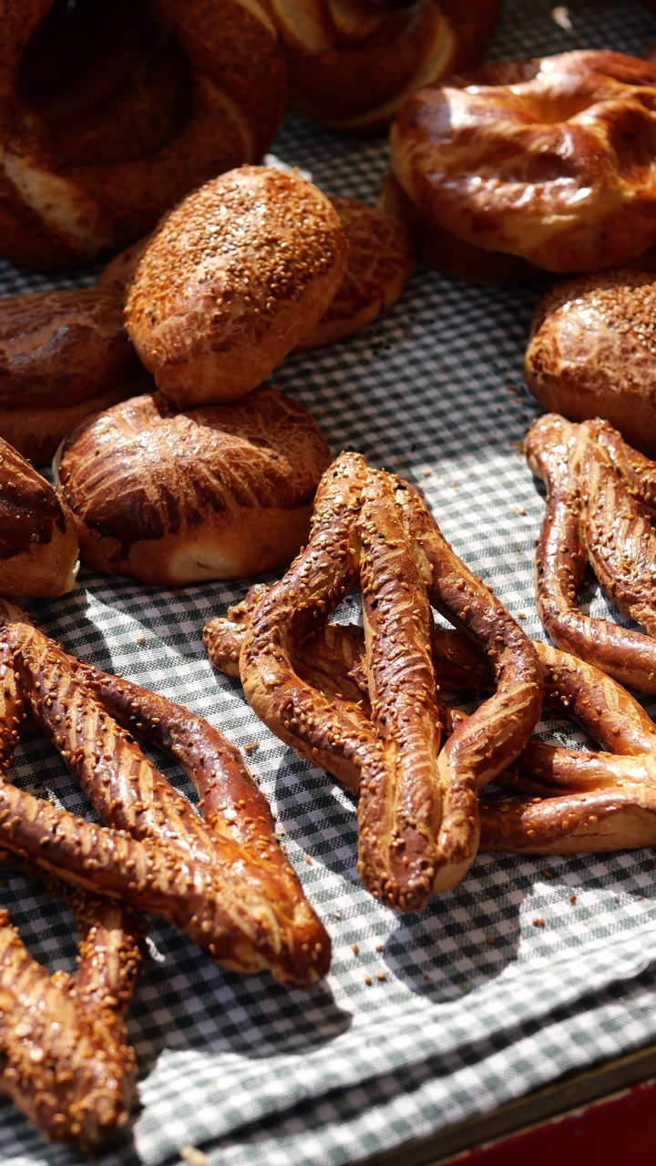 Golden Brown Pretzels and Pastries on a Checkered Tablecloth