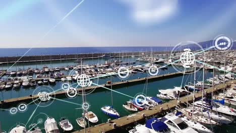 animation of graph and globe connected icons over aerial view of boat parked at marina