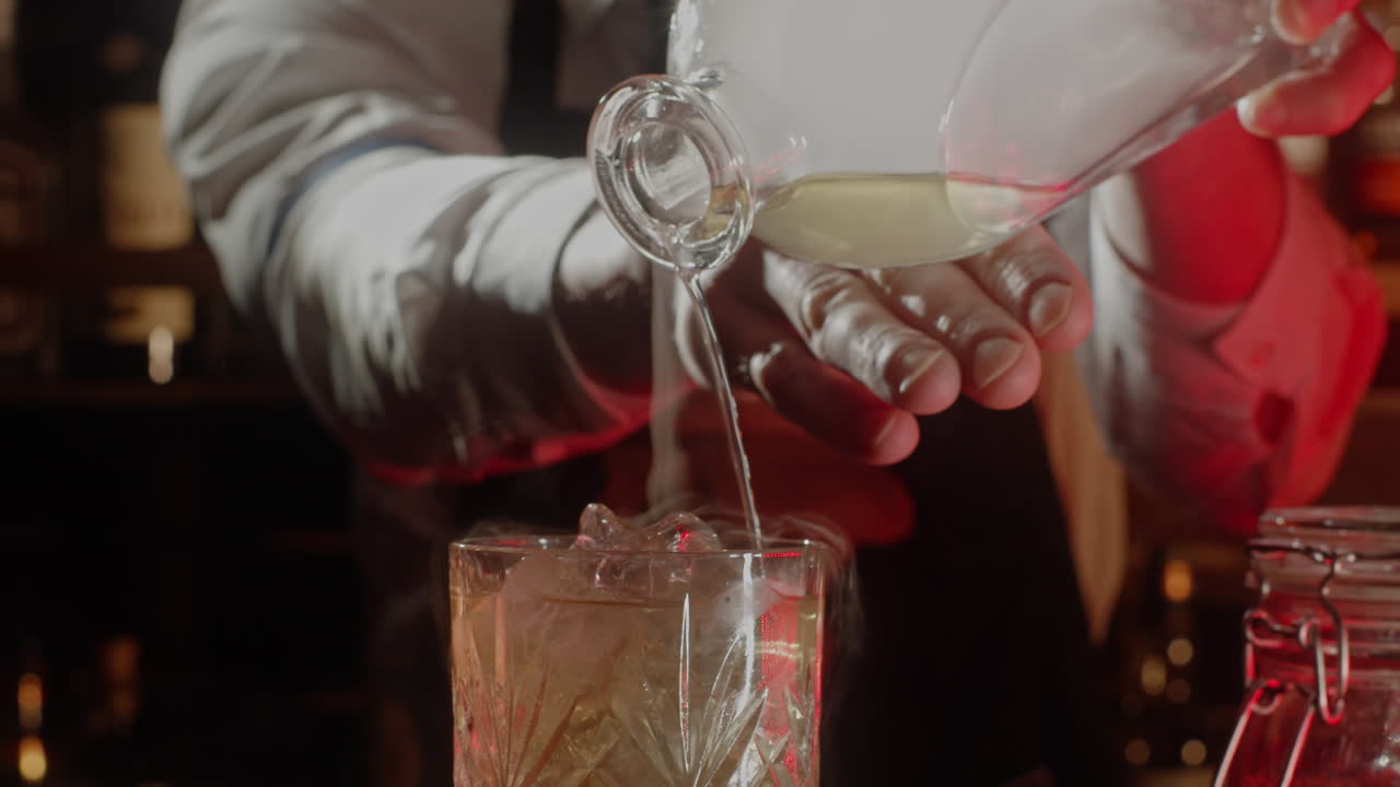 Bartender Pouring Cocktail with Smoke