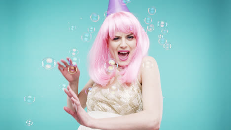 Single woman is sad in bubble shower slow motion photo booth blue background
