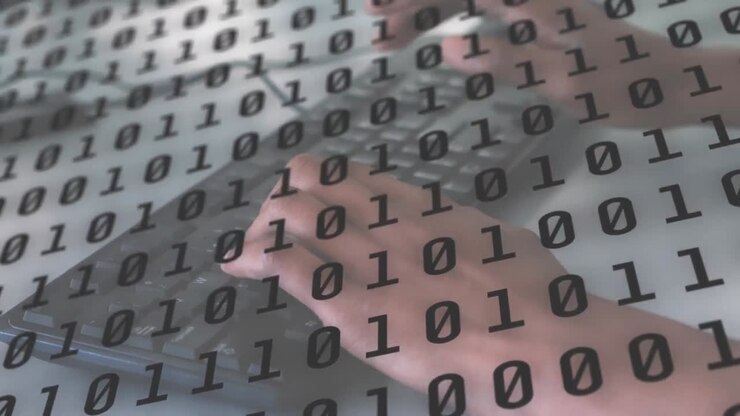 Binary coding data processing against person using laptop in background
