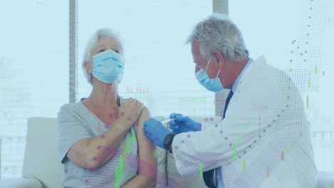 animation of data processing over caucasian woman being vaccinated by male doctor in face masks