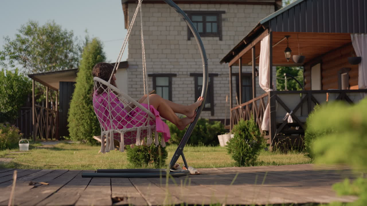Lady Dozing In Sunlight On Cottage Porch, Woman Peacefully Sleeping On Wooden Porch Under Gentle Breeze, Lady Enjoying Quiet Nap On Cozy Cottage Porch With Soft Sunlight And Breeze