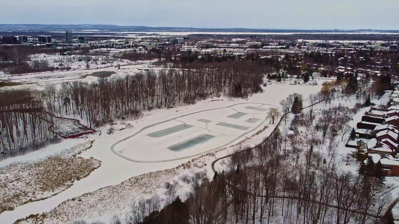 Outdoor rinks on pond in Canadian neighborhood