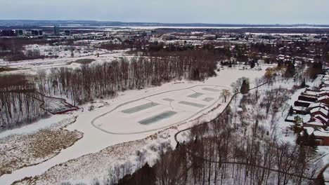 outdoor rinks on pond in canadian neighborhood