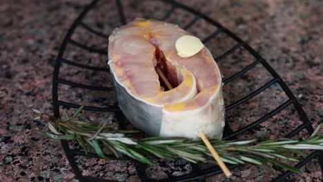 preparing grilled fish with garlic and herbs