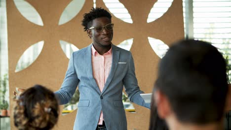 Confident-African-American-man-talking-during-presentation