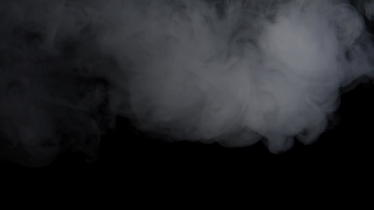 White Smoke Explosion And Spins Around Over Black Background, Slow Motion