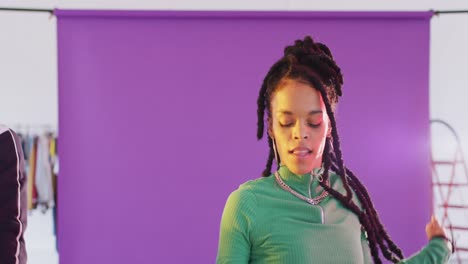 portrait of happy diverse male and female dancers dancing in dance studio, slow motion