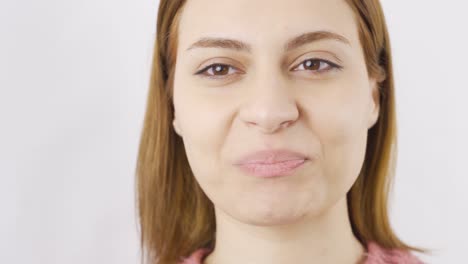 Close-up-woman-eats-nuts-and-dried-fruit.