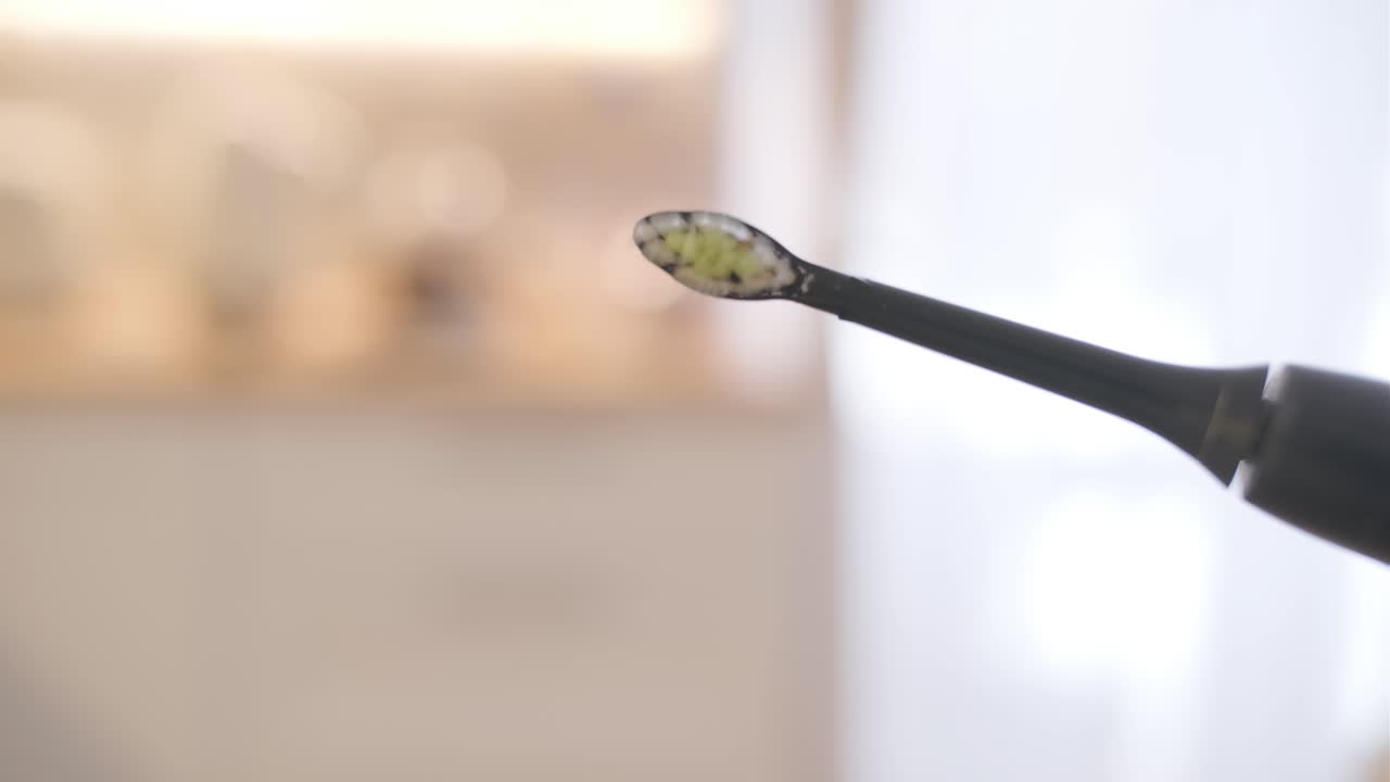 Close-up of a Vibrating Electric Toothbrush Head
