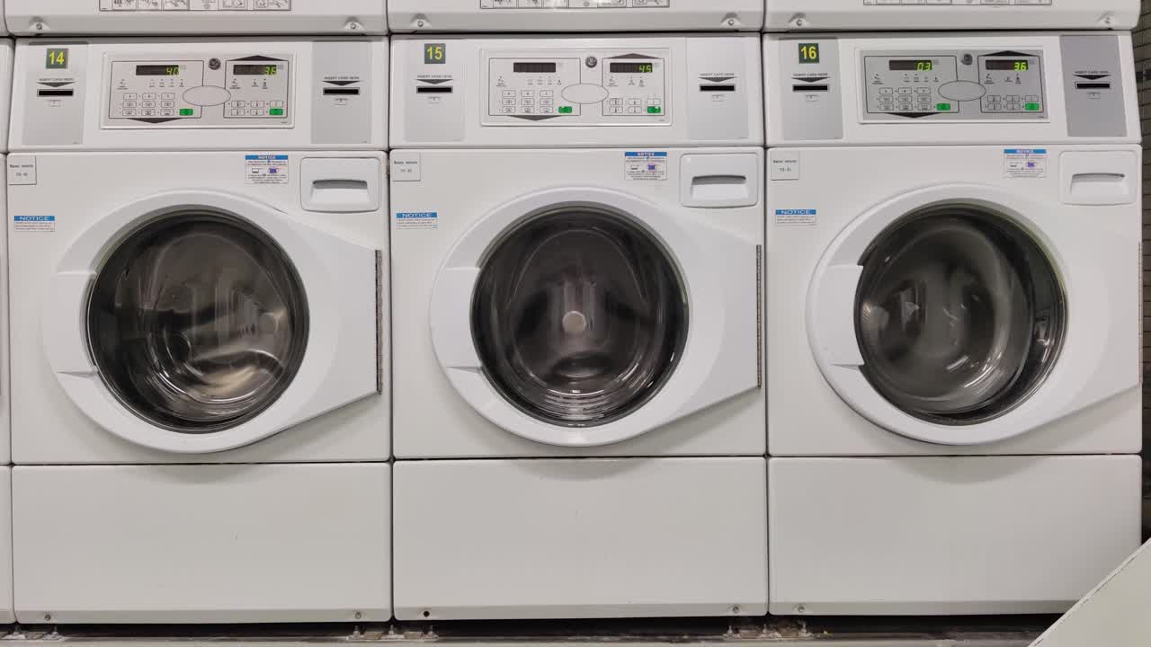 3 different clothing in domestic washing machine three washing Machines on different speed and power washing cloths video background Close-up video of spinning drum washing machine