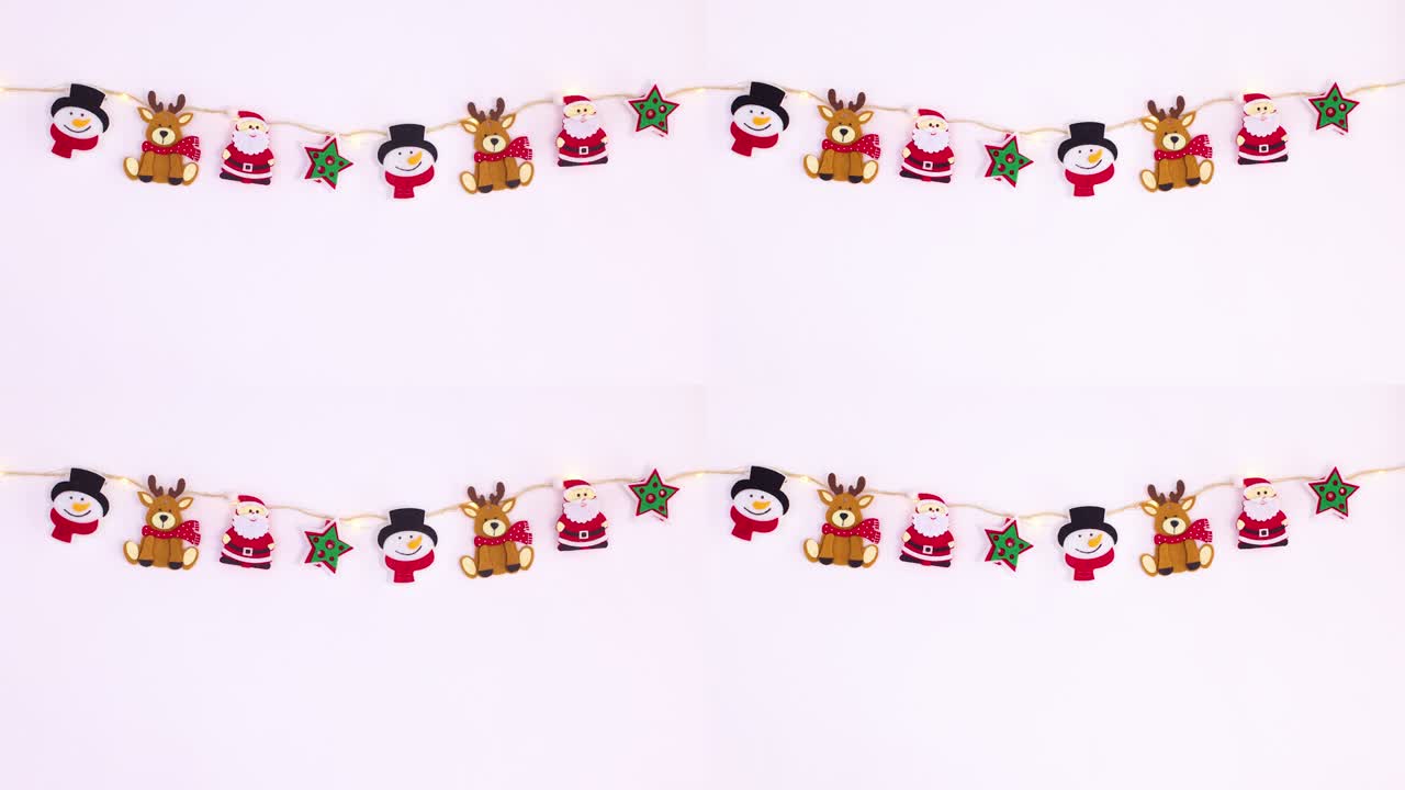 decoraciones de navidad colgadas en una cuerda con luces parpadeantes.