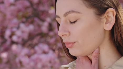 woman using a nasal spray outdoors
