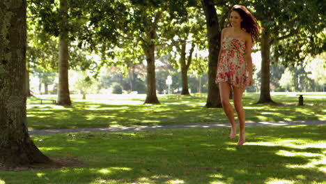 gorgeous brunette bouncing through park