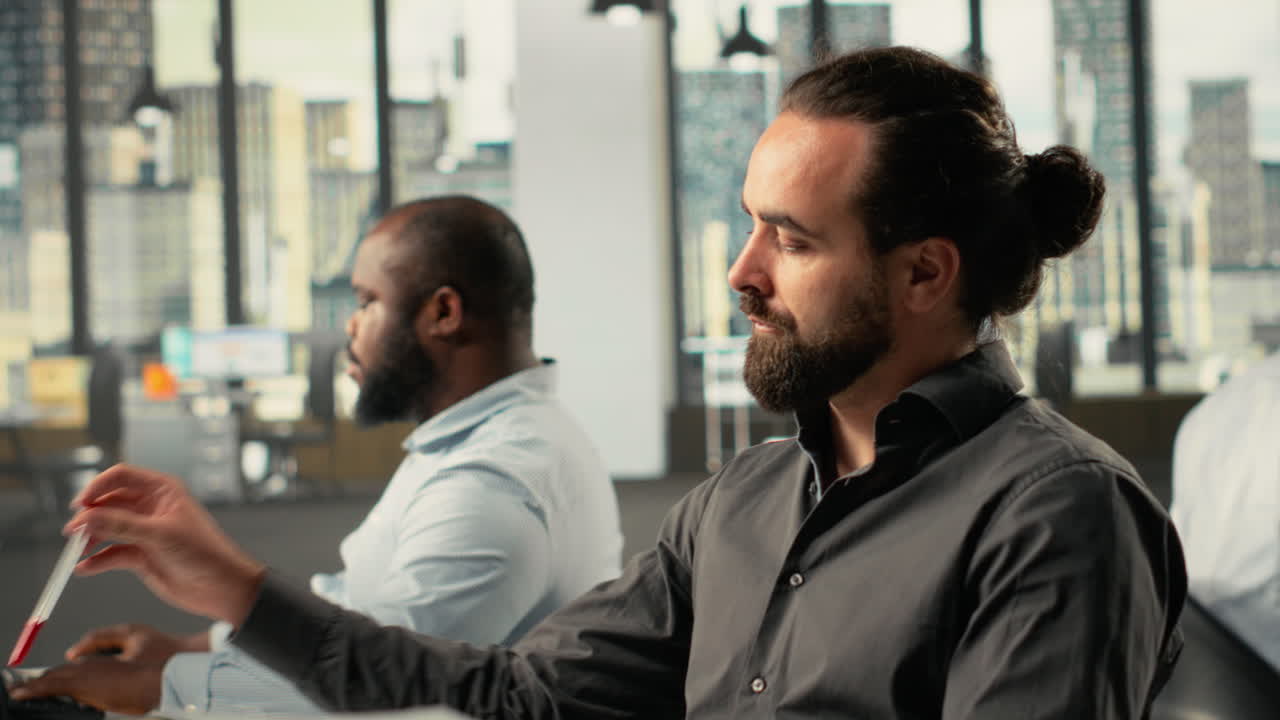 Vertical Video Corporate employees study business reports, charts, and analytics