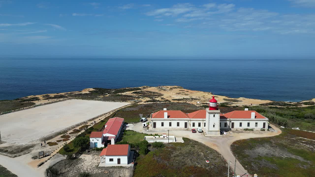 Portugal coast aerial retreats to reveal Cabo Sardao lighthouse