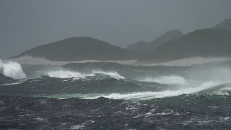 stormy ocean waves crashing against coastline