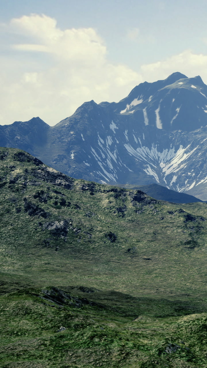 Mountains rise majestically under a clear blue sky in a serene wilderness