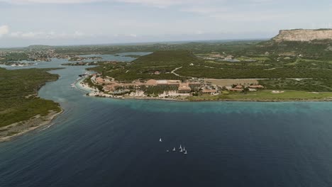 Santa-Barbara-Beach-high-altitud-aerial-shot-of-private-beach-on-the-Dutch-Caribbean-island-of-Curaçao,-located-at-the-southeast-of-island