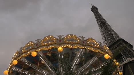 vintage carousel and eiffel tower in the evening